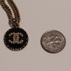 Chanel  Zipper Pull With a Chanel Stamp Black/gold